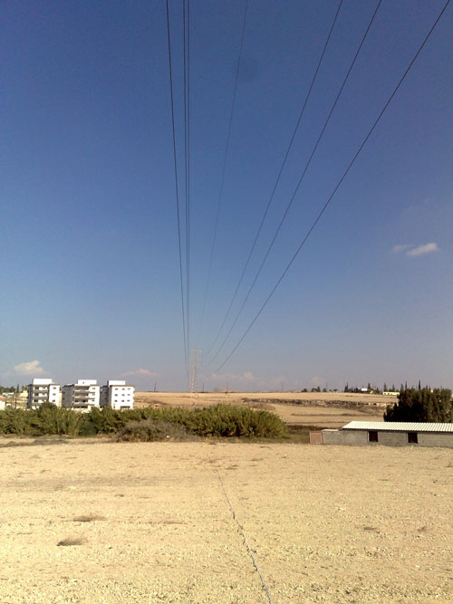 Along the overhead power lines